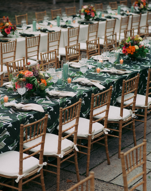 Monstra and tropical themed wedding tables with trpoical flower center pieces