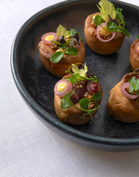 Bonbite catering plated small bite of beef tartare yorkshire pudding