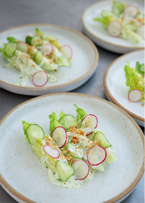 Bonbite first course plated baby romaine wedge salad with buttermilk dressing and brioche crumble