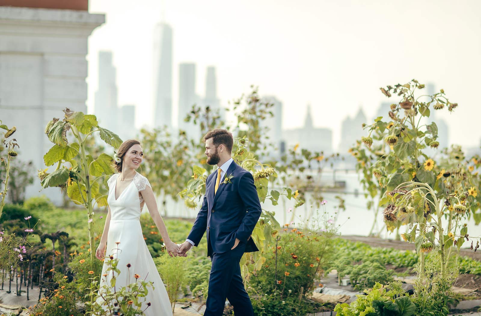 Wedding couple walking through the BK Grange Farm at the Brooklyn Navy Yard