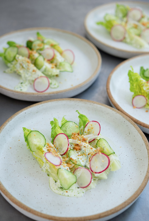 Bonbite first course plated baby romaine wedge salad with buttermilk dressing and brioche crumble