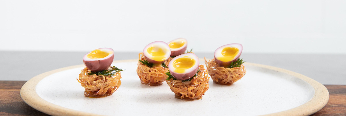 Bonbite catering quail egg in a birds nest small bite