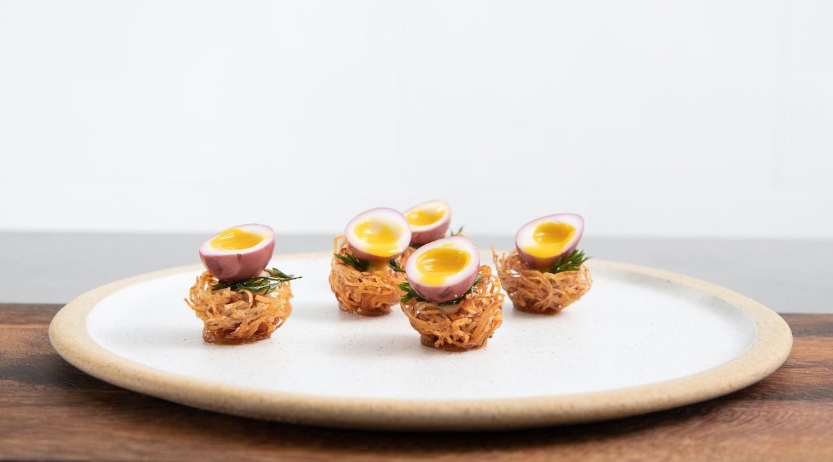 Bonbite catering quail egg in a birds nest small bite