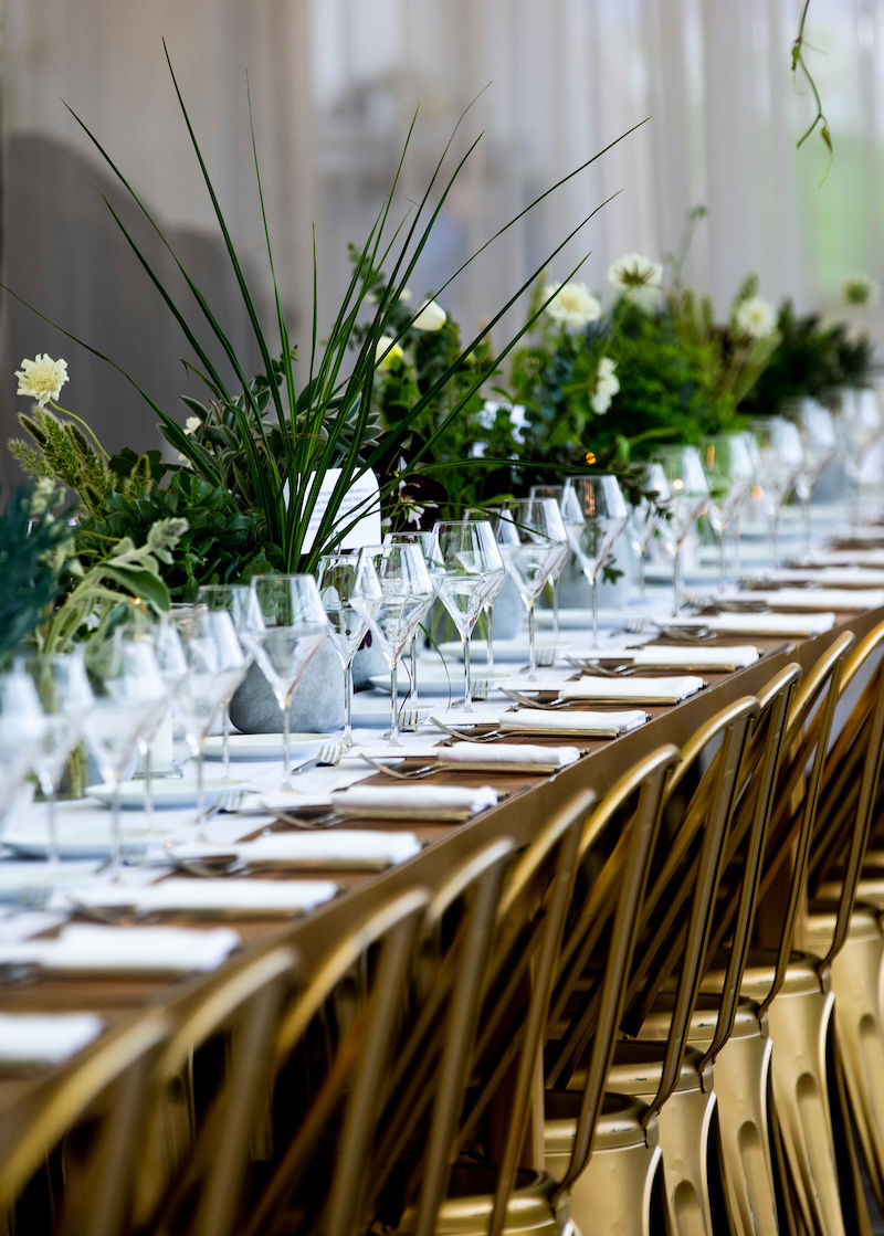 Bonbite catering dinner table setting diagonal long shot at the Brooklyn Grange in the Brooklyn Navy Yard