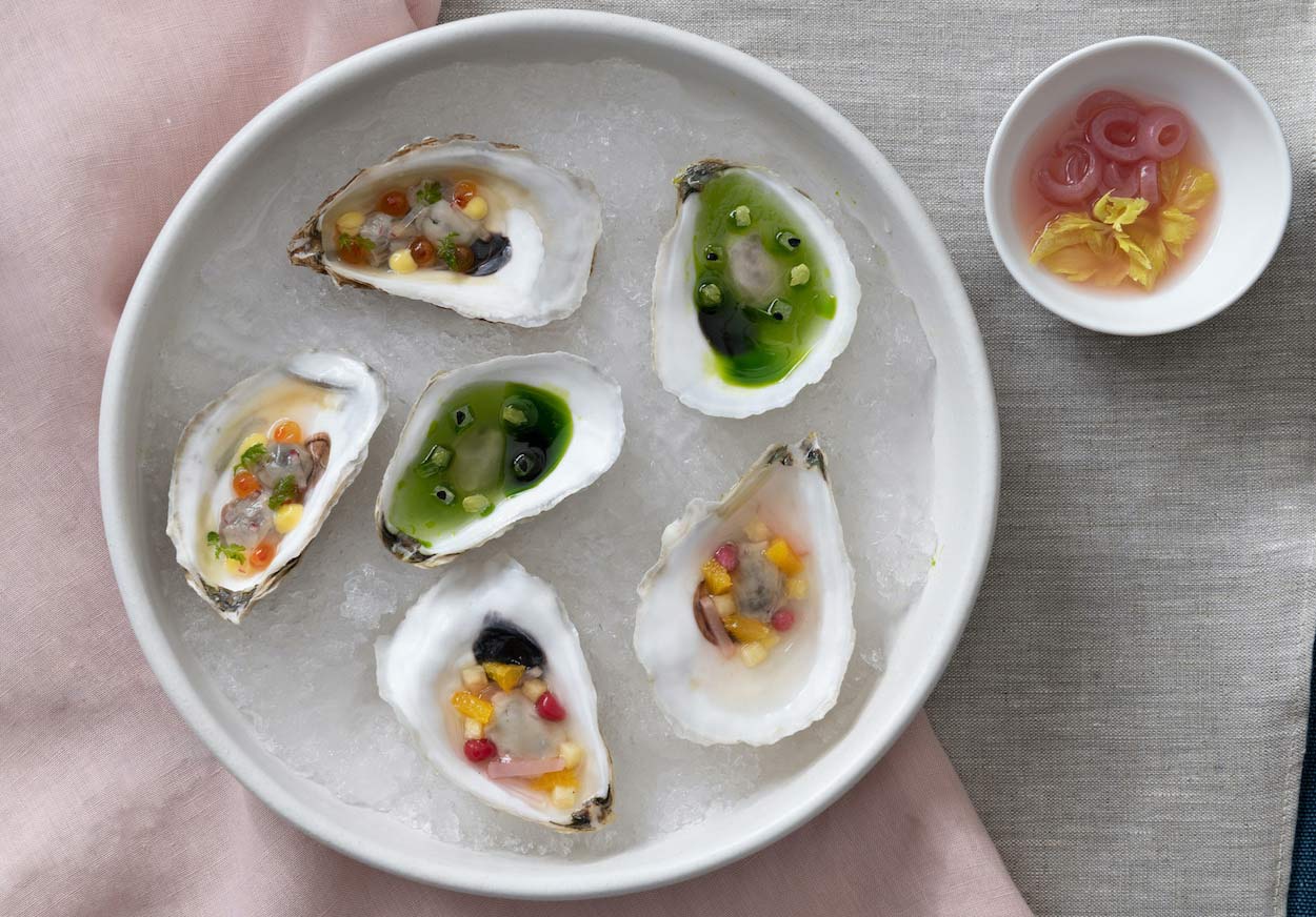 Bonbite catering plated oysters on the half shell with seasonal mignonettes