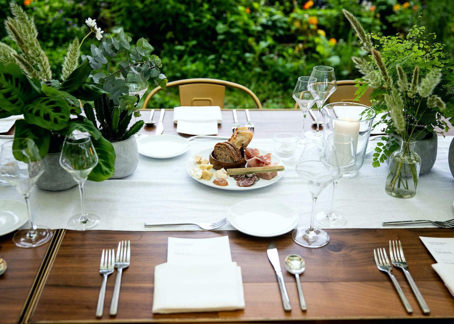 Bonbite table setting at the Brooklyn Grange in the Brooklyn navy yard with table side charcuterie and cheese plate