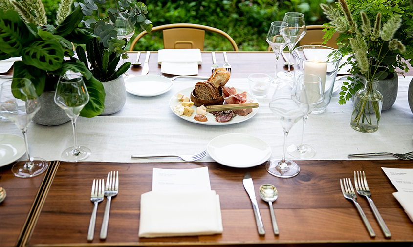 Bonbite table setting at the Brooklyn Grange in the Brooklyn navy yard with table side charcuterie and cheese plate